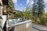 Outdoor private hot tub provides a lovely space to relax. 